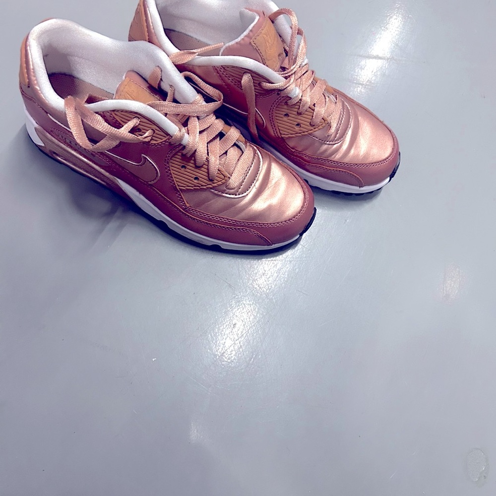 Gold new Nike sneakers never worn size 7 in woman .
